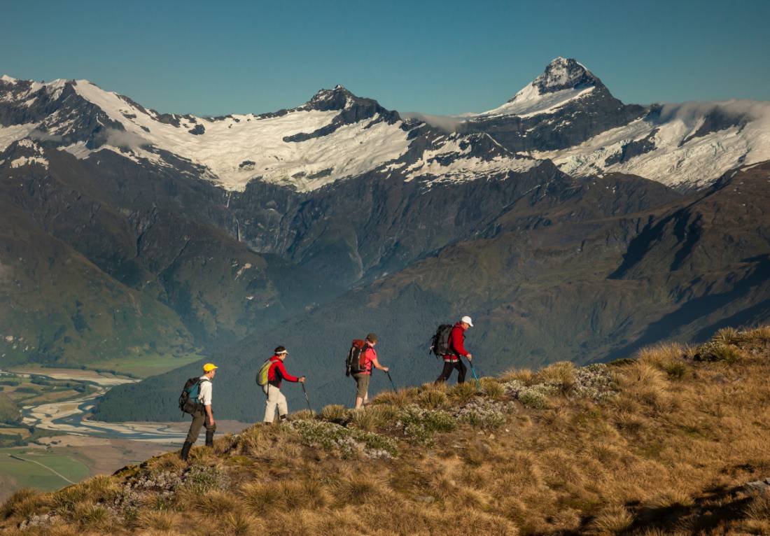 Trekkers on Buchanan peak with Mount Aspiring behind, walking above Matukituki valley, near Lake Wanaka |  <i>Colin Monteath</i>