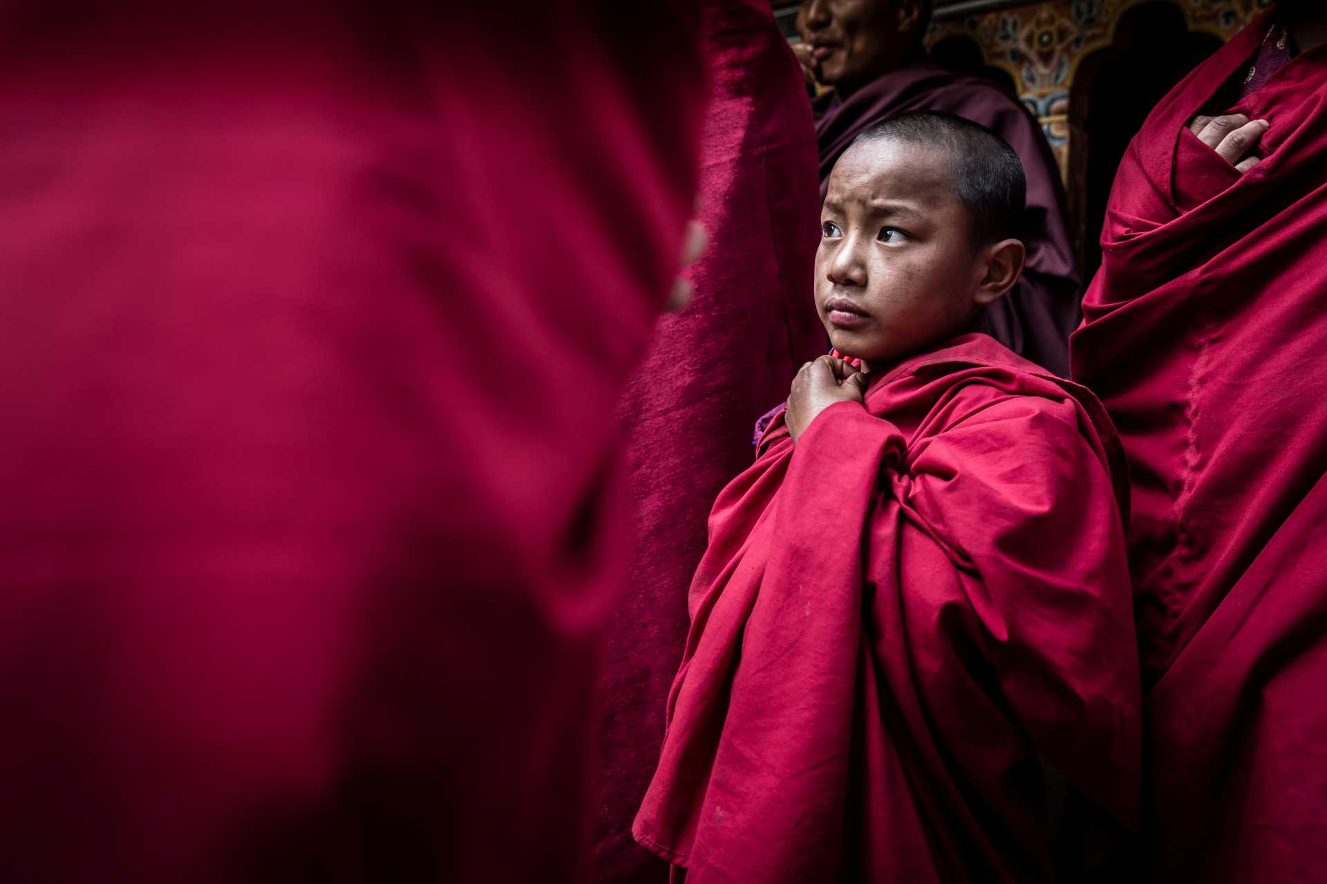 Novice Bhutanese monk enjoying the festival |  Richard I'Anson